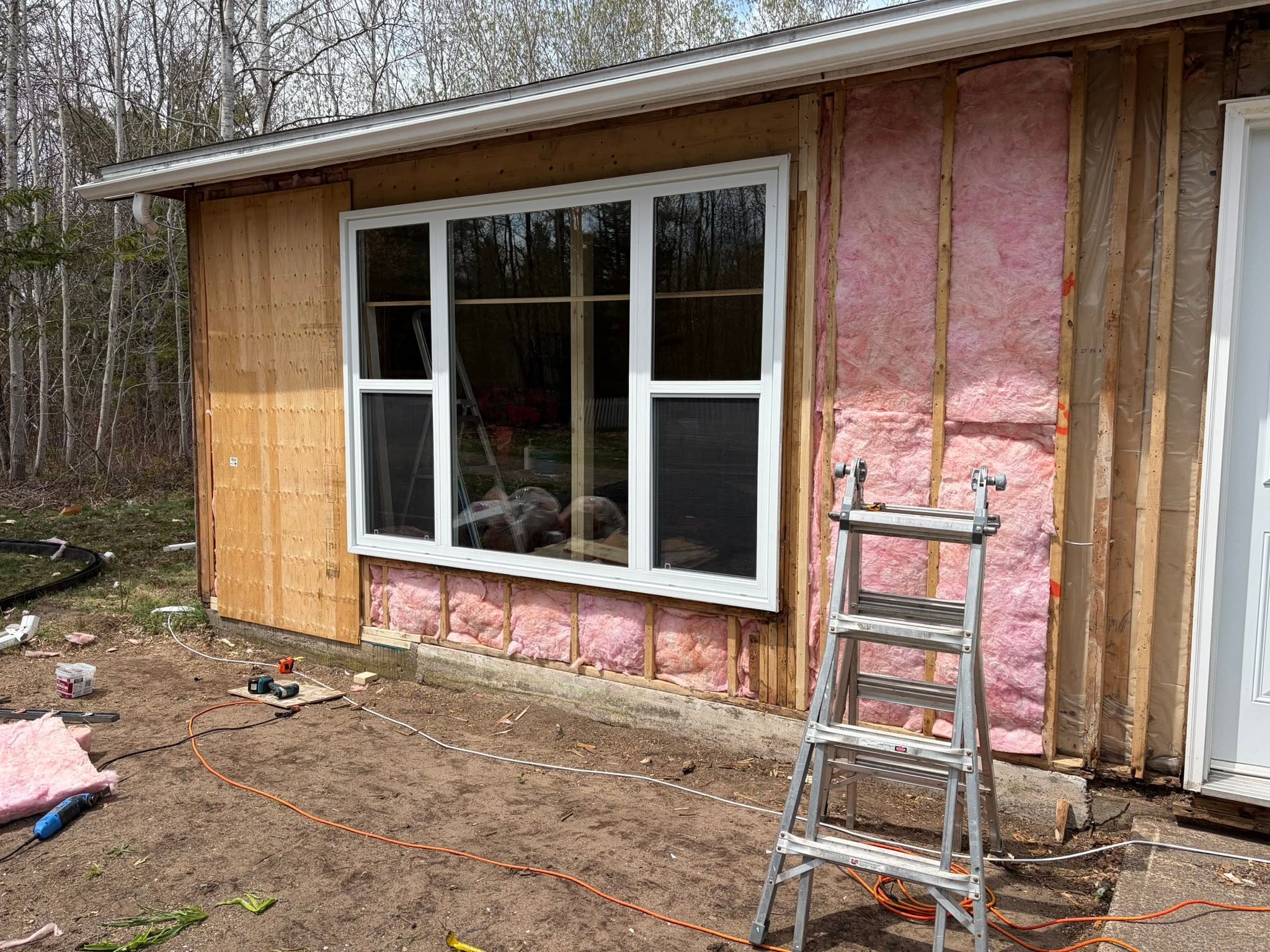 New window installation with framing and insulation work